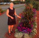 Little black dress & flowers: Susan just found a deal on dress. Go figure. Looks great by flower bed.